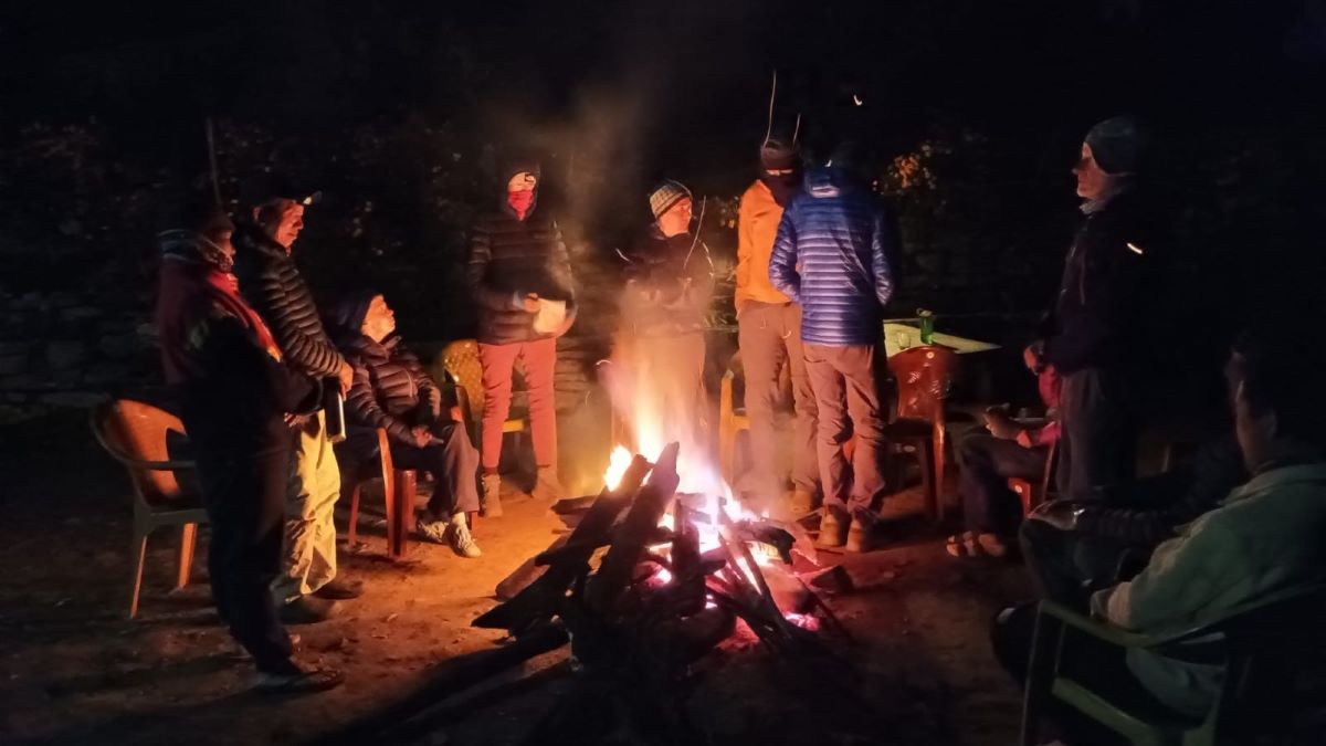 Trekkers enjoying campfire in Kanchenjunga Accommodation