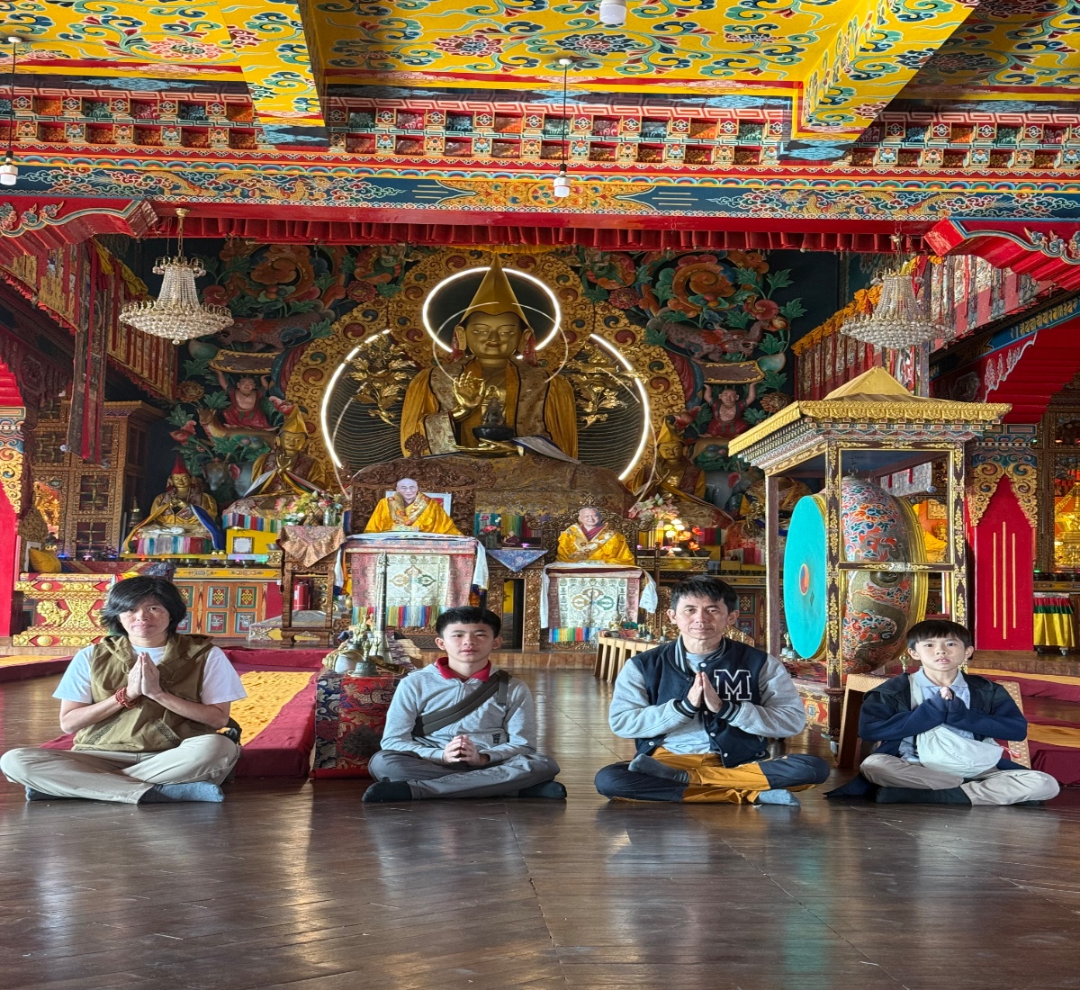 A family visiting the Pharping monastery during Buddhist pilgrimage tour in Nepal