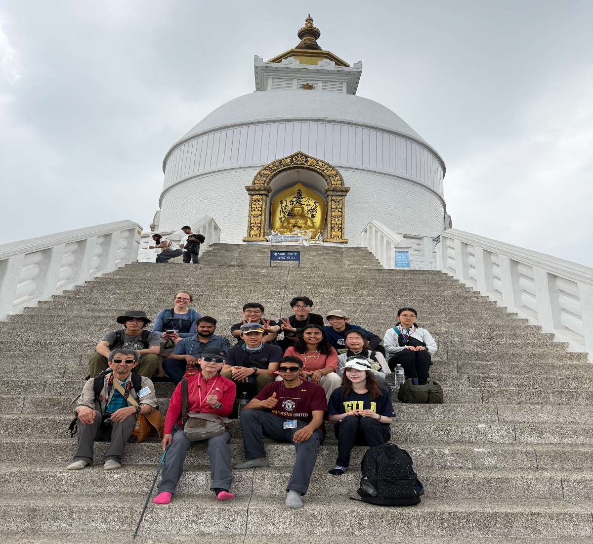 Happy tourists at the World Peace Pagoda in Lumbini